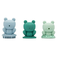 Drei farbige Frosch-Spielzeuge in Blau, Grün und Mint mit Bürsten- und Texturdetails