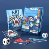 Haifisch-Spiel mit bunten Karten und Würfeln für Familienunterhaltung
